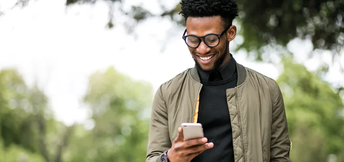 african american man using phone; Shutterstock ID 641303035; Purchase Order: Creative Services; Job: Creative Services; Client/Licensee: Voya Financial; Other: AG