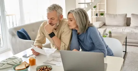 Older couple reviewing their finances.